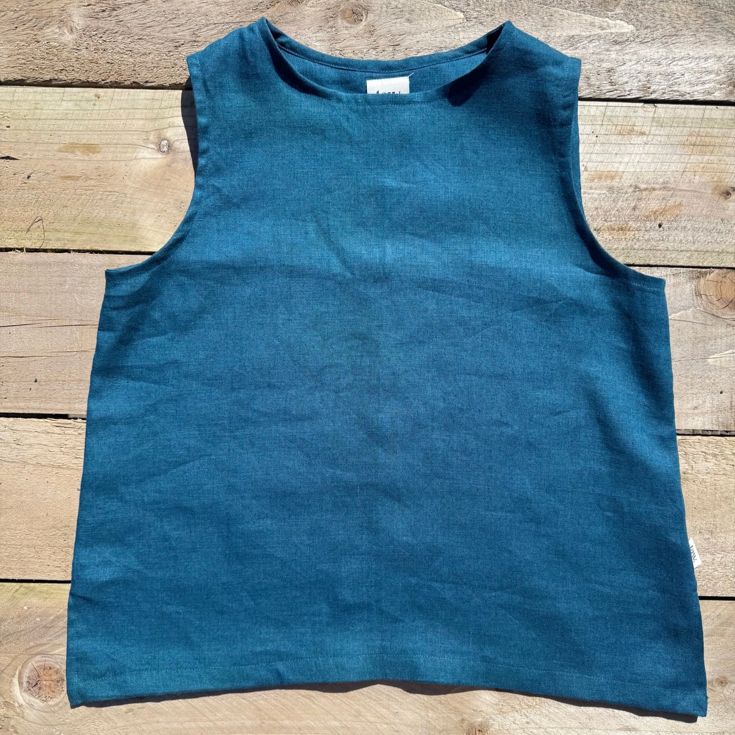 teal coloured vest