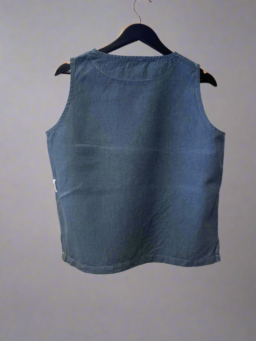 Blue denim dress on a white surface