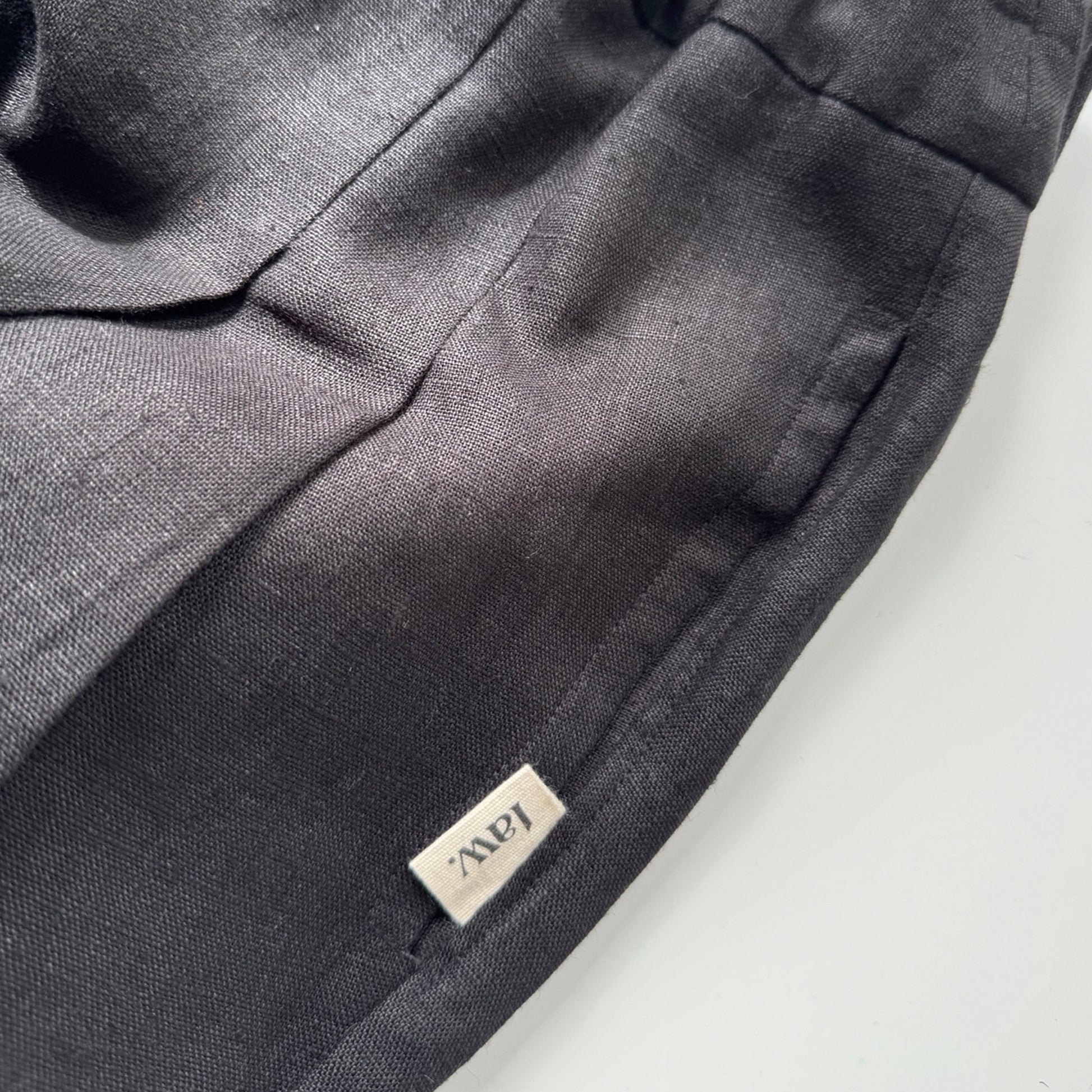 black linen pleated trousers