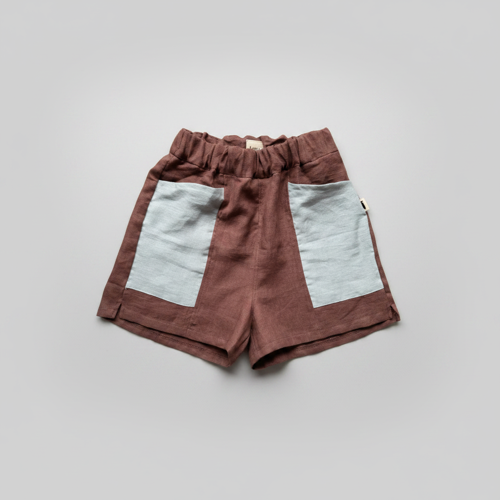 Brown shorts with gray patches on a white background