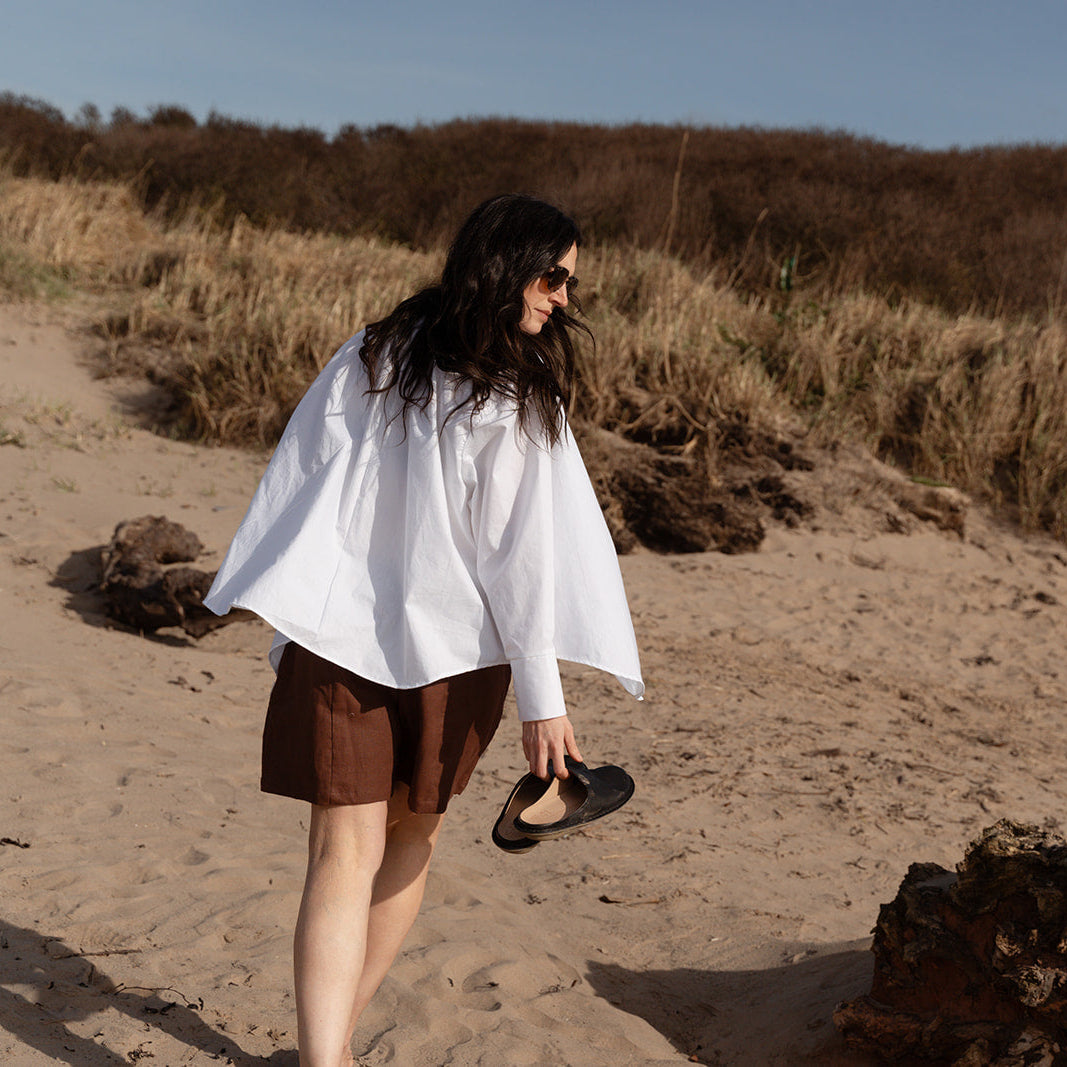 Girl in white shirt on beach