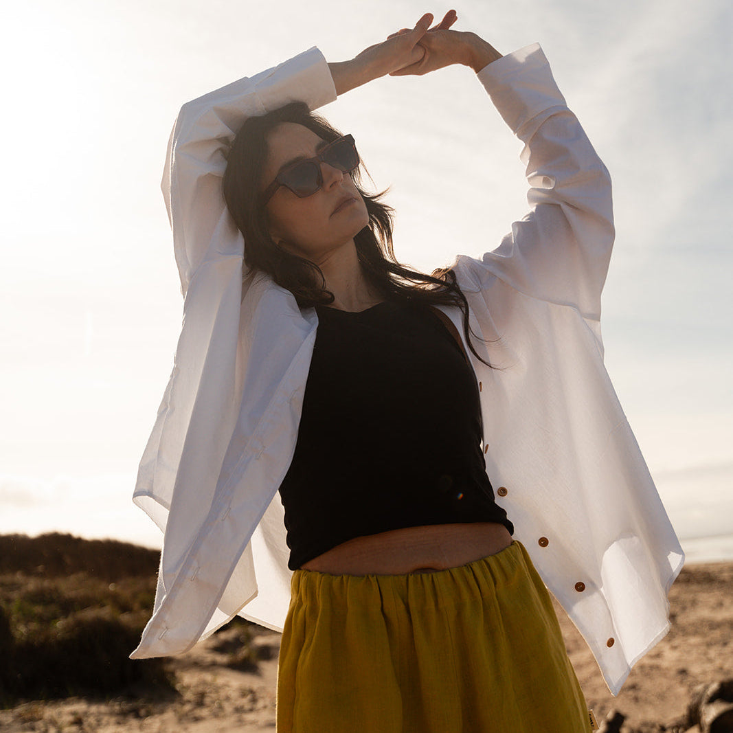 white shirt with yellow linen trousers