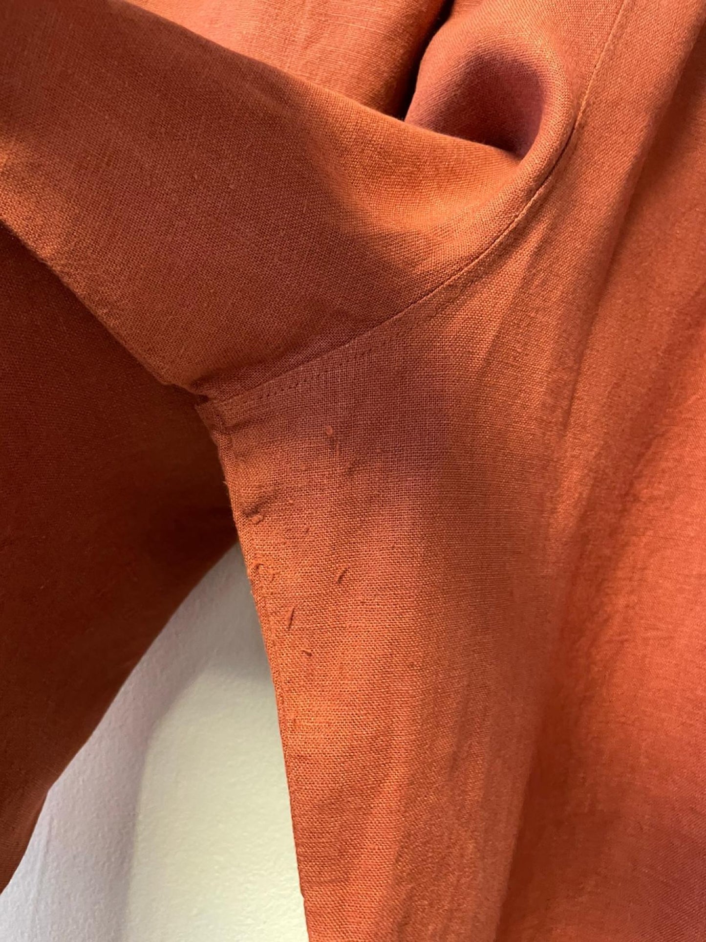 Close-up of orange fabric with a white background