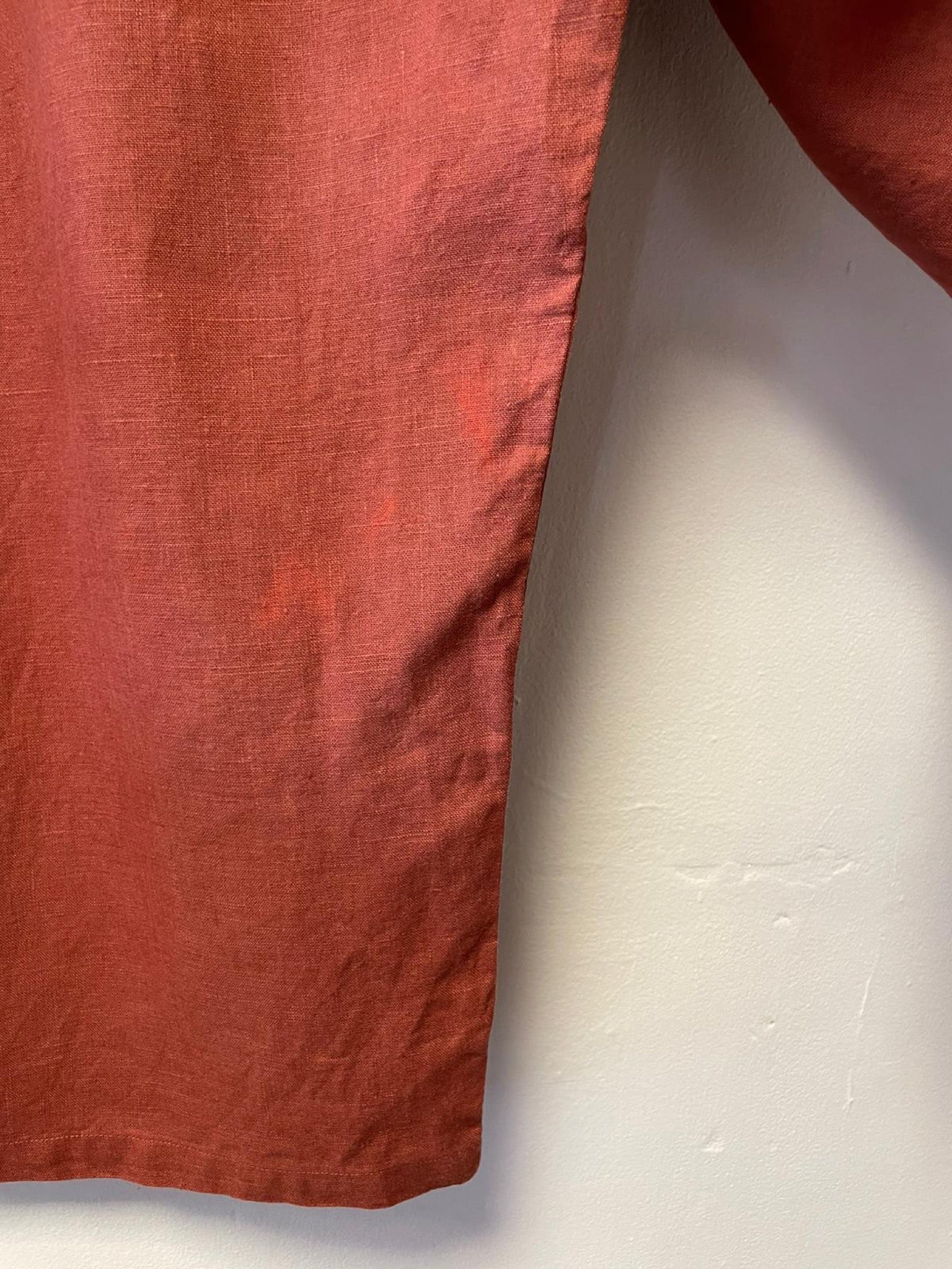Close-up of a red fabric corner on a white background